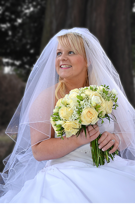 Relaxed bride portrait in the garden of Scottish hotel by wedding photographer Alexander Whyte Relaxed bride portrait in the garden of Scottish hotel by wedding photographer Alexander Whyte