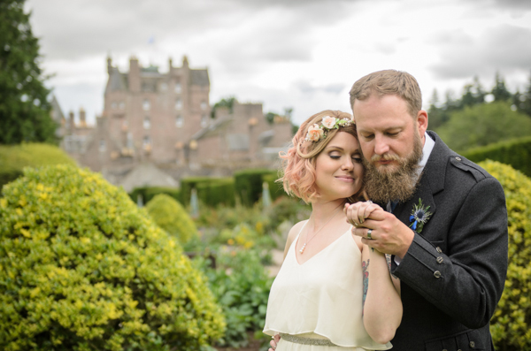 Relaxed bride portrait in the garden of Scottish hotel by wedding photographer Alexander Whyte Relaxed bride groom portrait in the garden of Scottish castle by wedding photographer Alexander Whyte